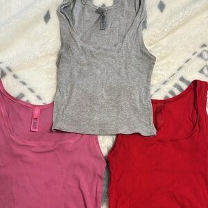 SKIMS Ribbed Tank Tops in Gray, Pink & Red